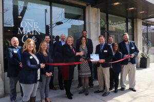 Large group outside for ribbon cutting for One Main