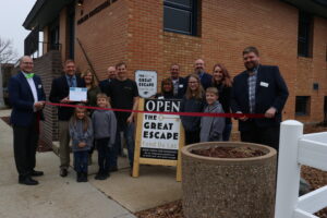 Large group outside for ribbon cutting for the Great Escape