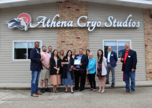 Large group of people at ribbon cutting