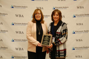 Two women with an award