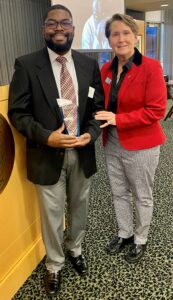 Garry Moise and Kate Candee with an award