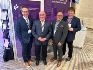 Four men at a conference