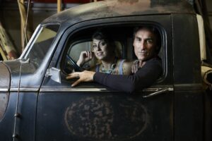 A woman and a man in a truck