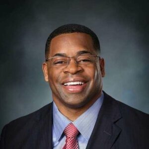 A professional man with glasses
