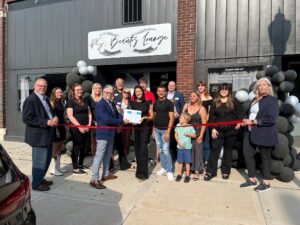 Large group outside for a ribbon cutting