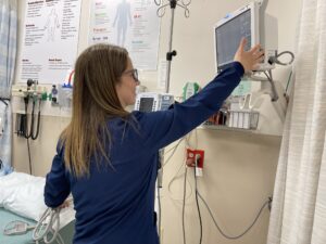 Nurse next to a hospital bed