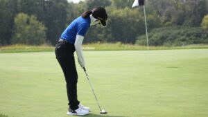 A person golfing