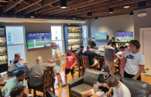 A large group by a TV