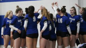 A group of women playing volleyball
