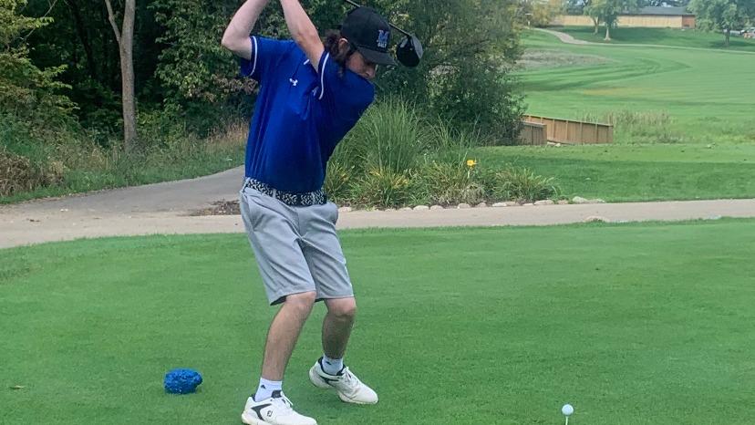 A man golfing