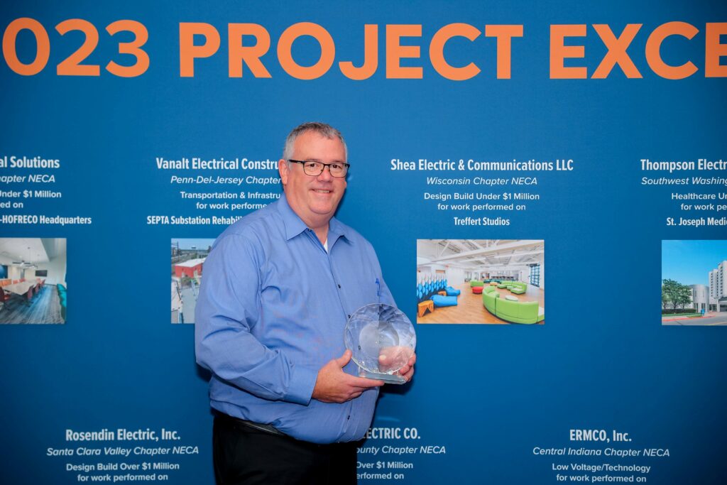 A man holding an award