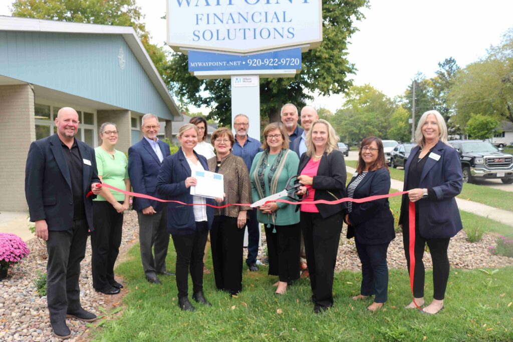 A large group outside for a ribbon cutting