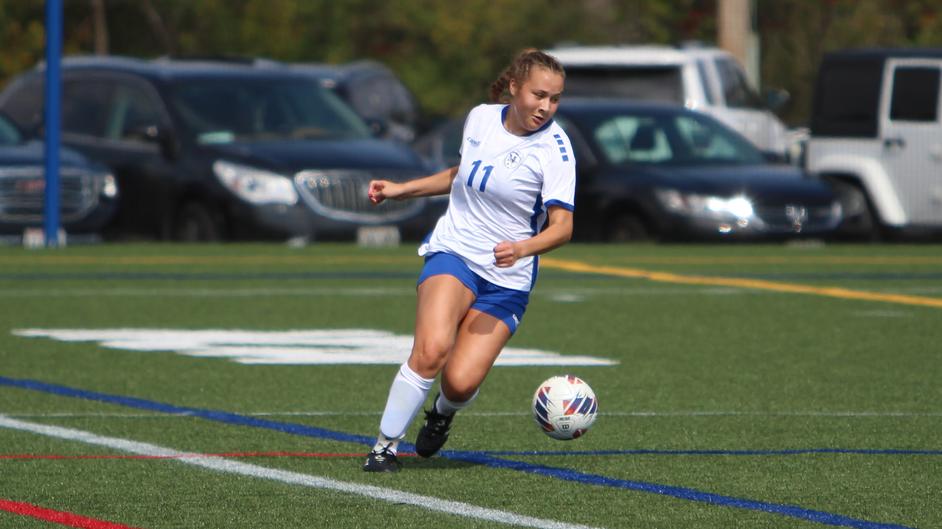 A woman playing soccer