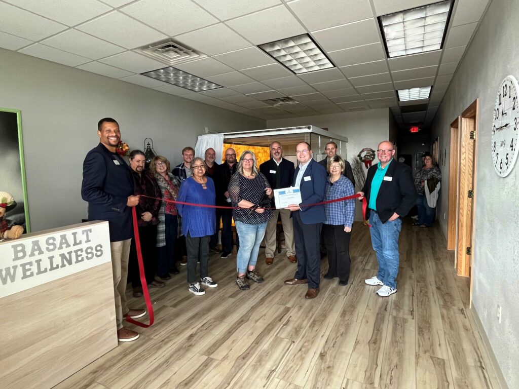 A large group inside for a ribbon cutting