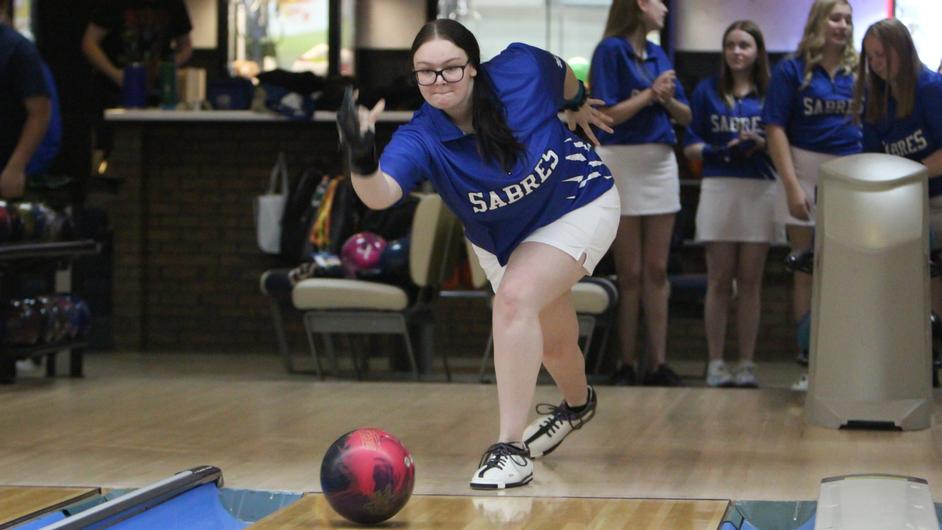 A woman bowling