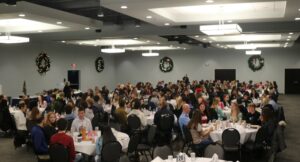 A large group of people at round tables