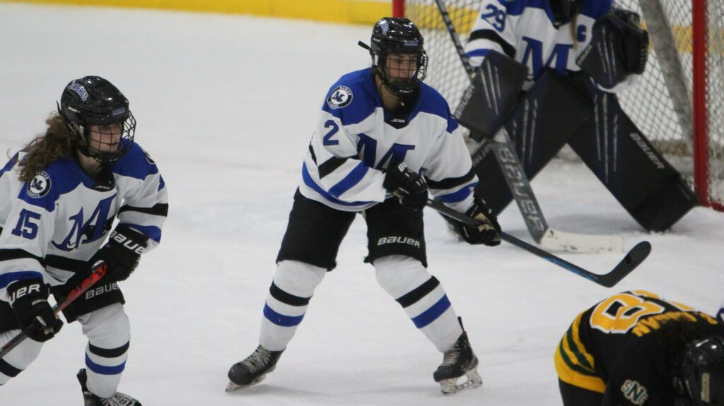 women playing college hockey