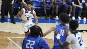 Men playing college basketball