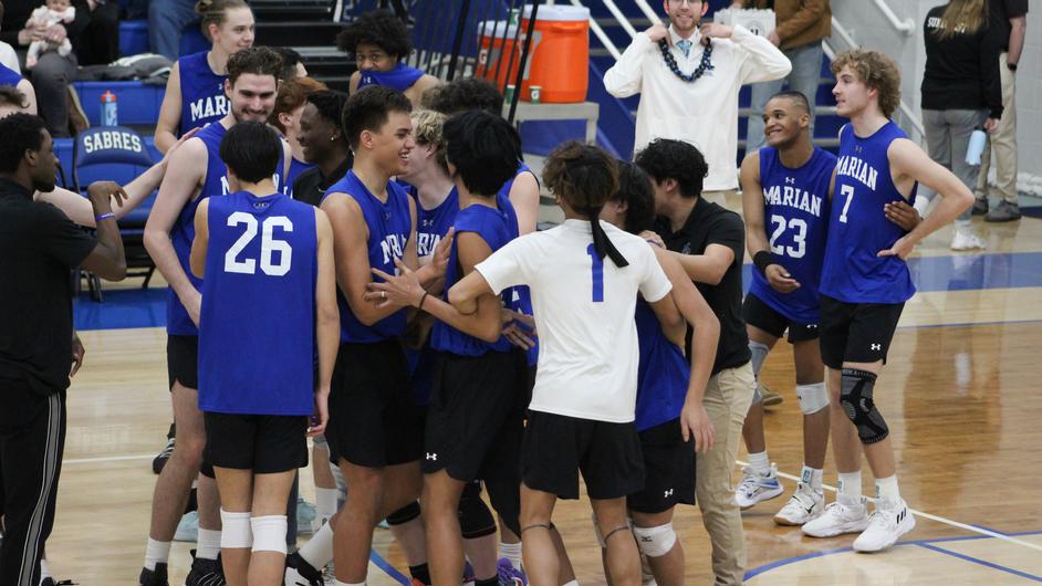 A group of men playing college volleyball