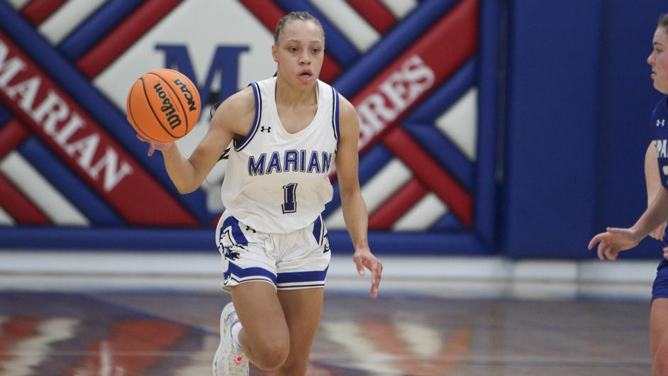 A woman playing college basketball