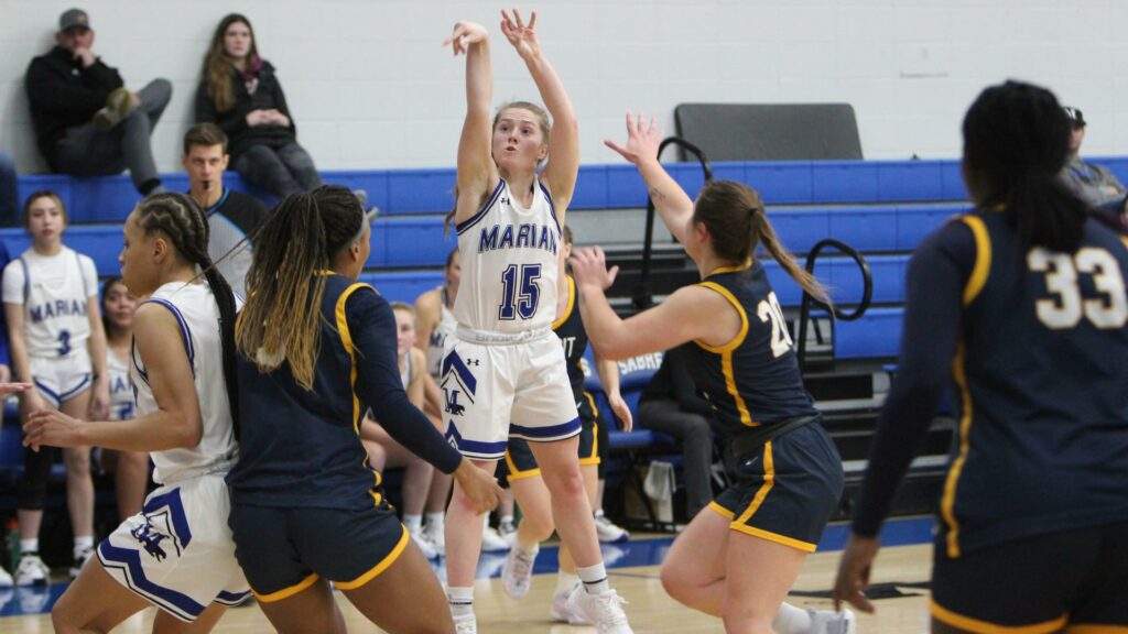 Women playing college basketball