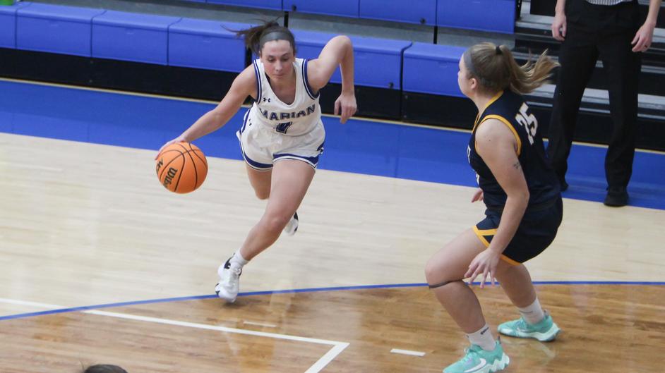 Women playing college basketball
