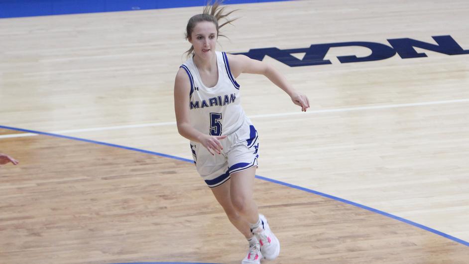 A woman playing basketball