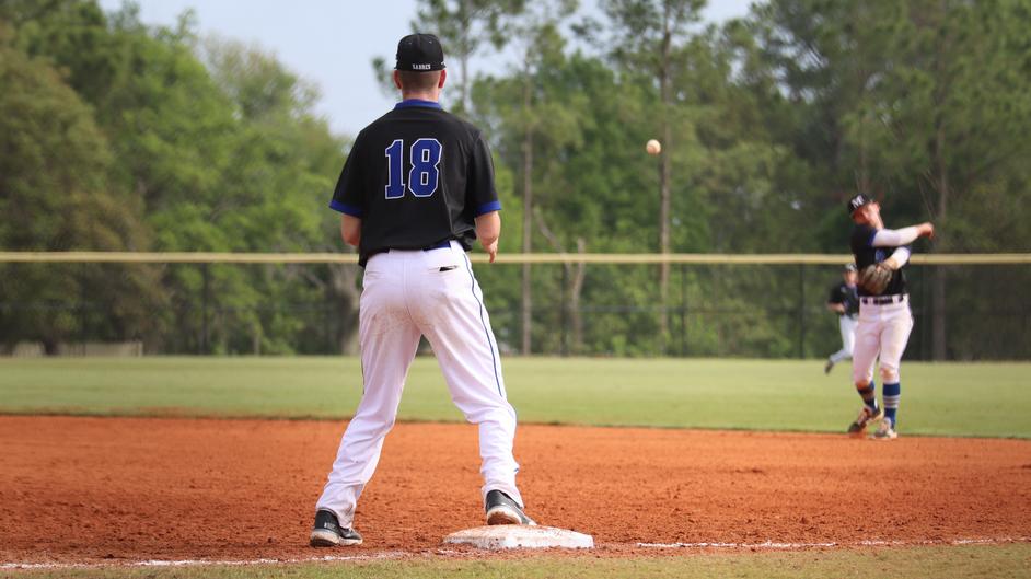 Two men playing college baseball