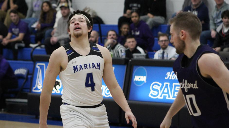 Two men playing college basketball