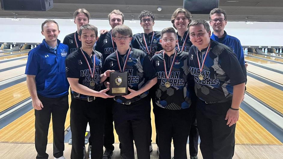 A mens bowling team with trophy