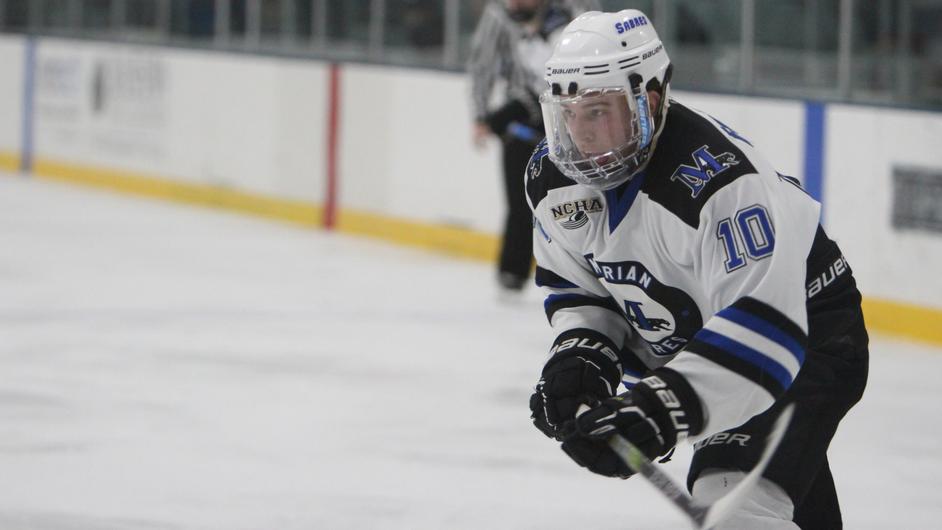 A man playing college hockey