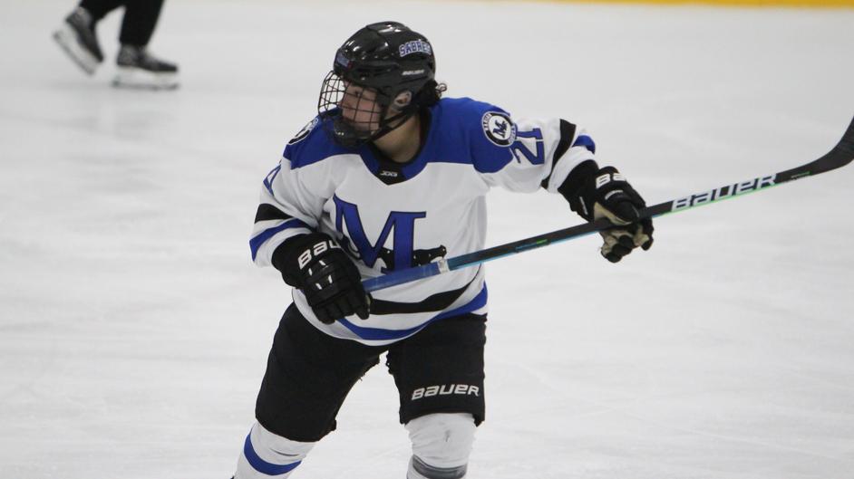 A woman playing hockey