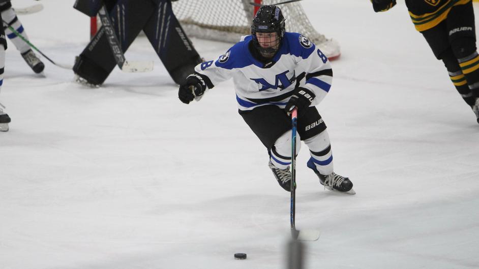 Women playing college hockey