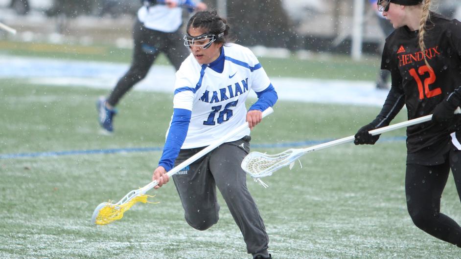 Women playing college lacrosse