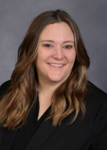 A woman with long hair wearing a black shirt