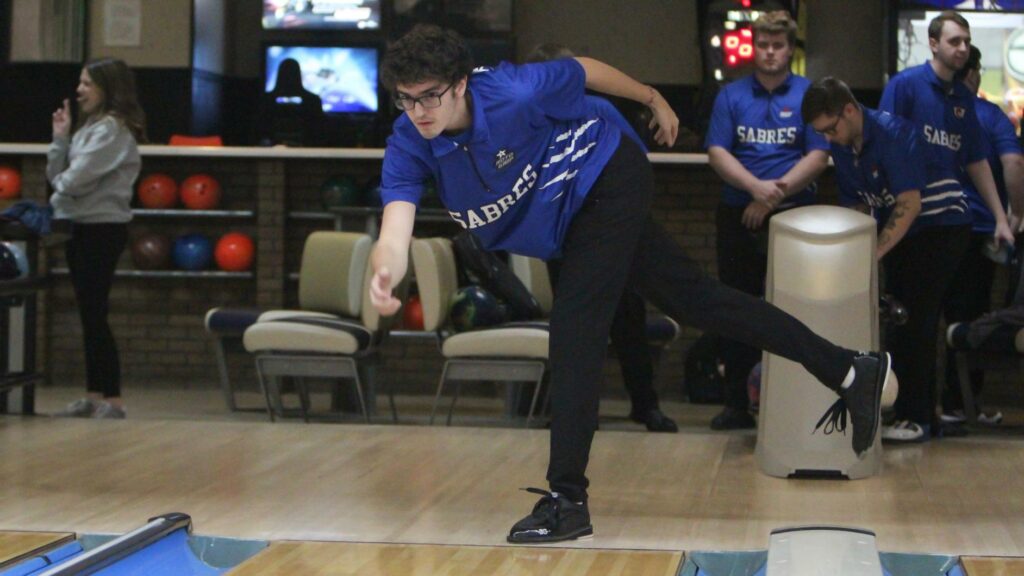 A man bowling for his college team