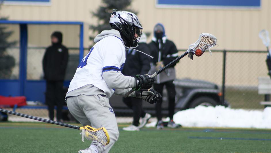 A man playing college lacrosse