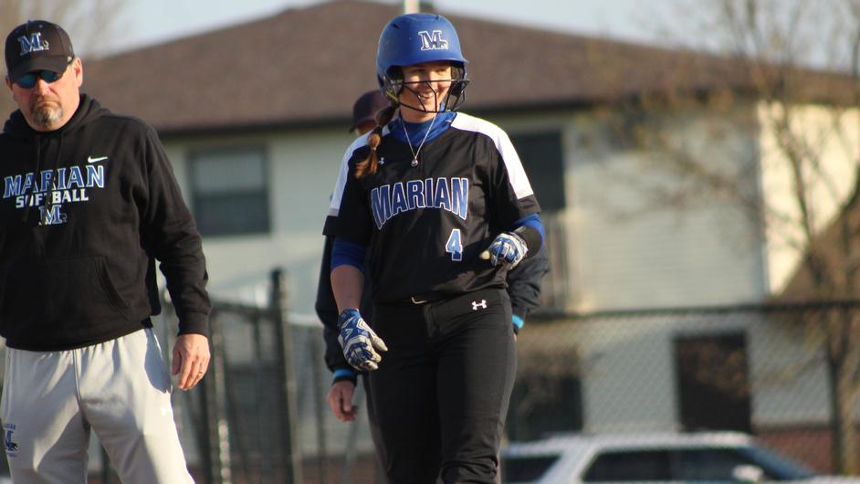 Women playing college softball