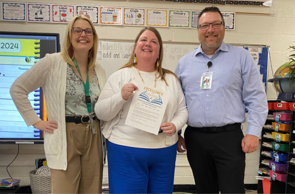 Three teachers with a certifcate