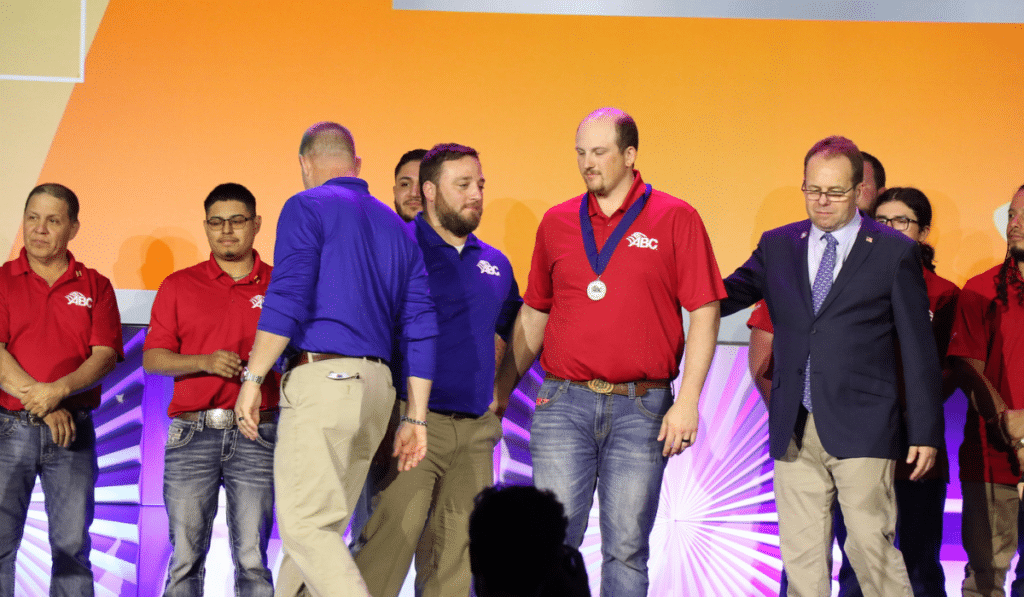 People on stage receiving awards