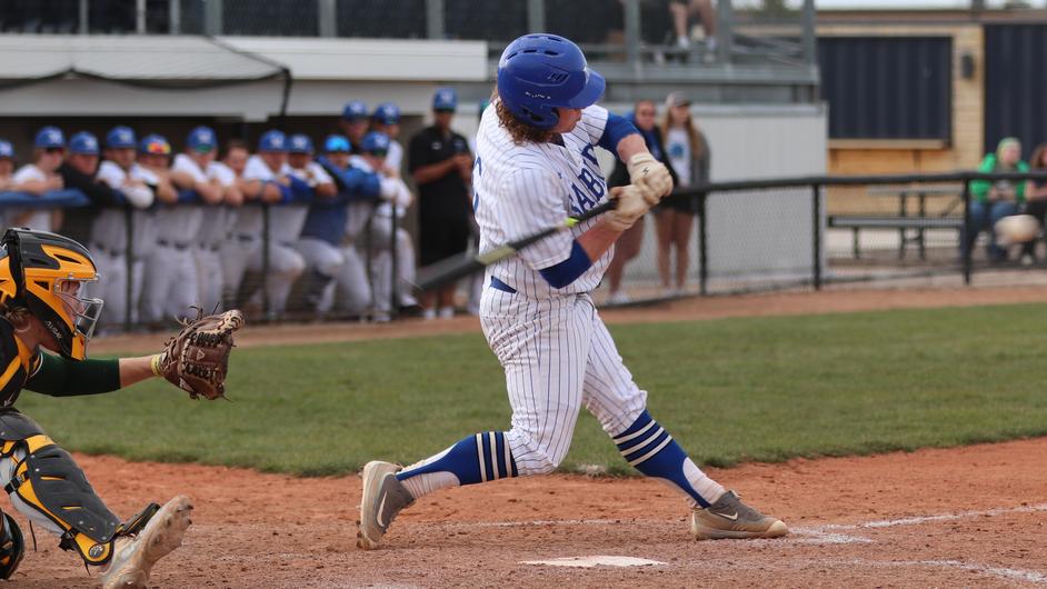A man batting in a college baseball game