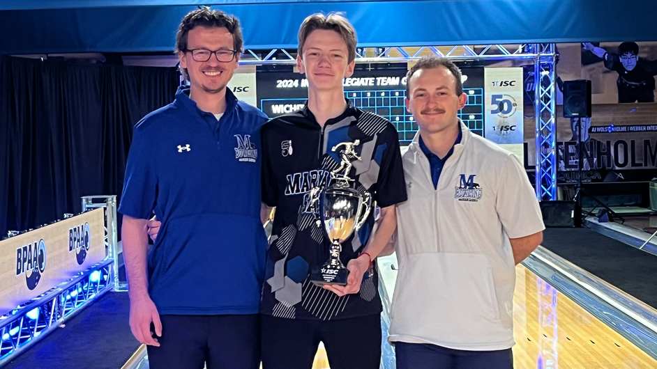 Three men with a trophy