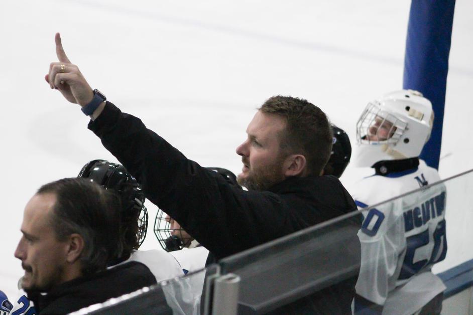 Hockey coaches on the bench