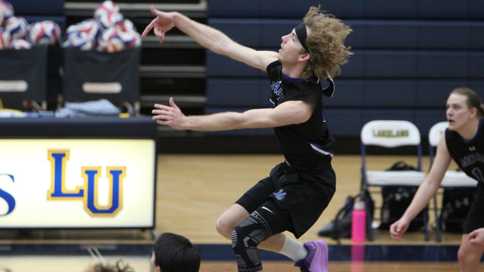 Men playing college volleyball