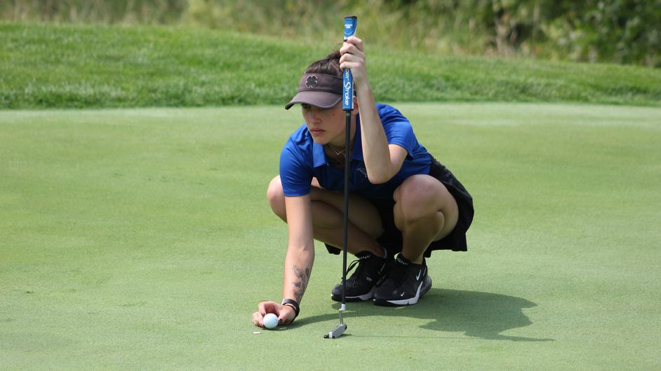 A woman playing golf