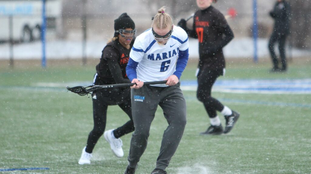 Women playing lacrosse