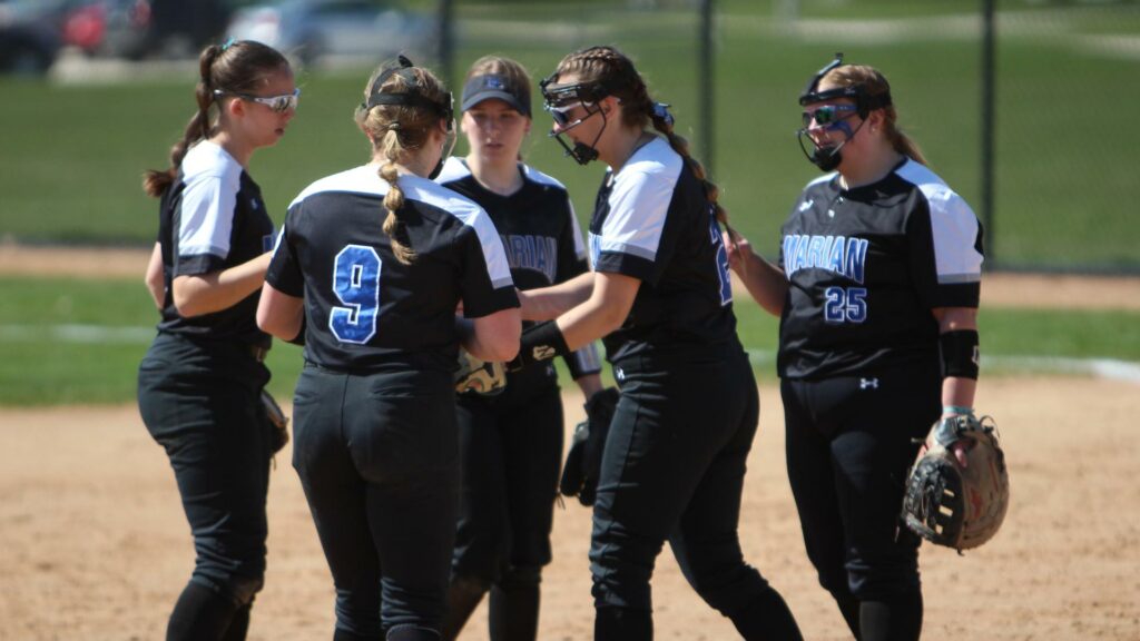 Women playing college softball