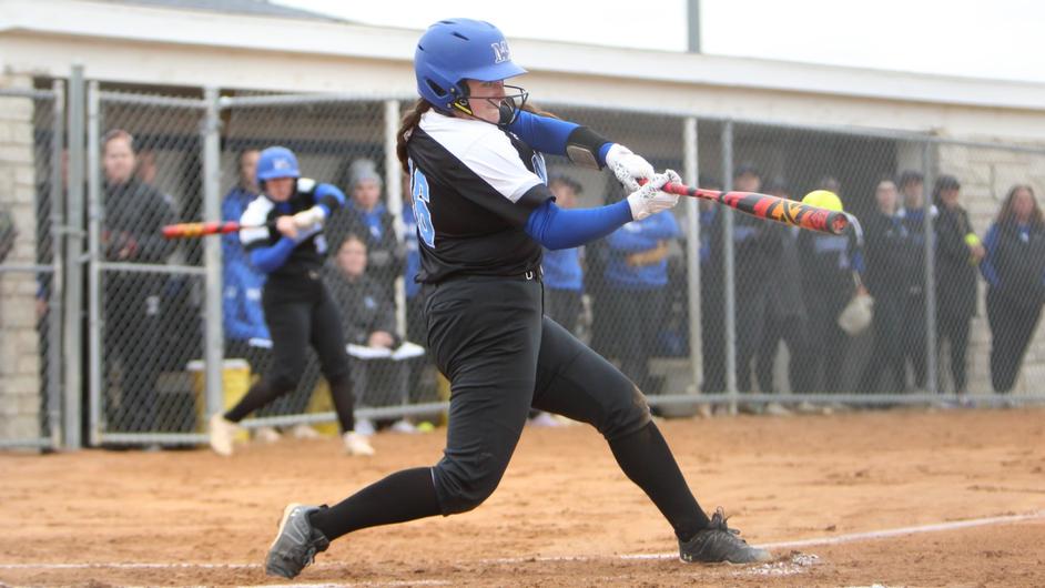 A female batter in a college game