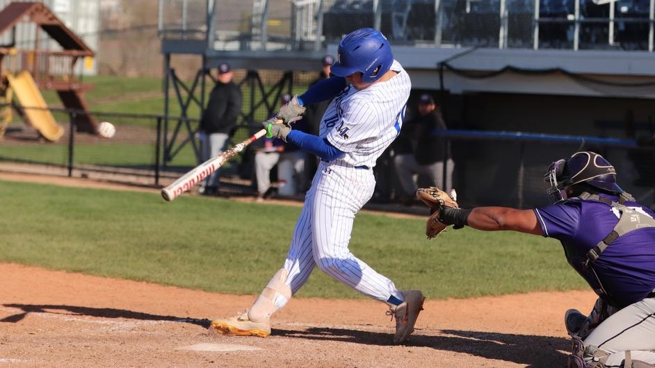 A man batting in a college baseball game