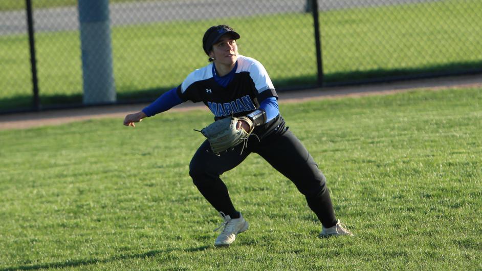 A woman playing college softball